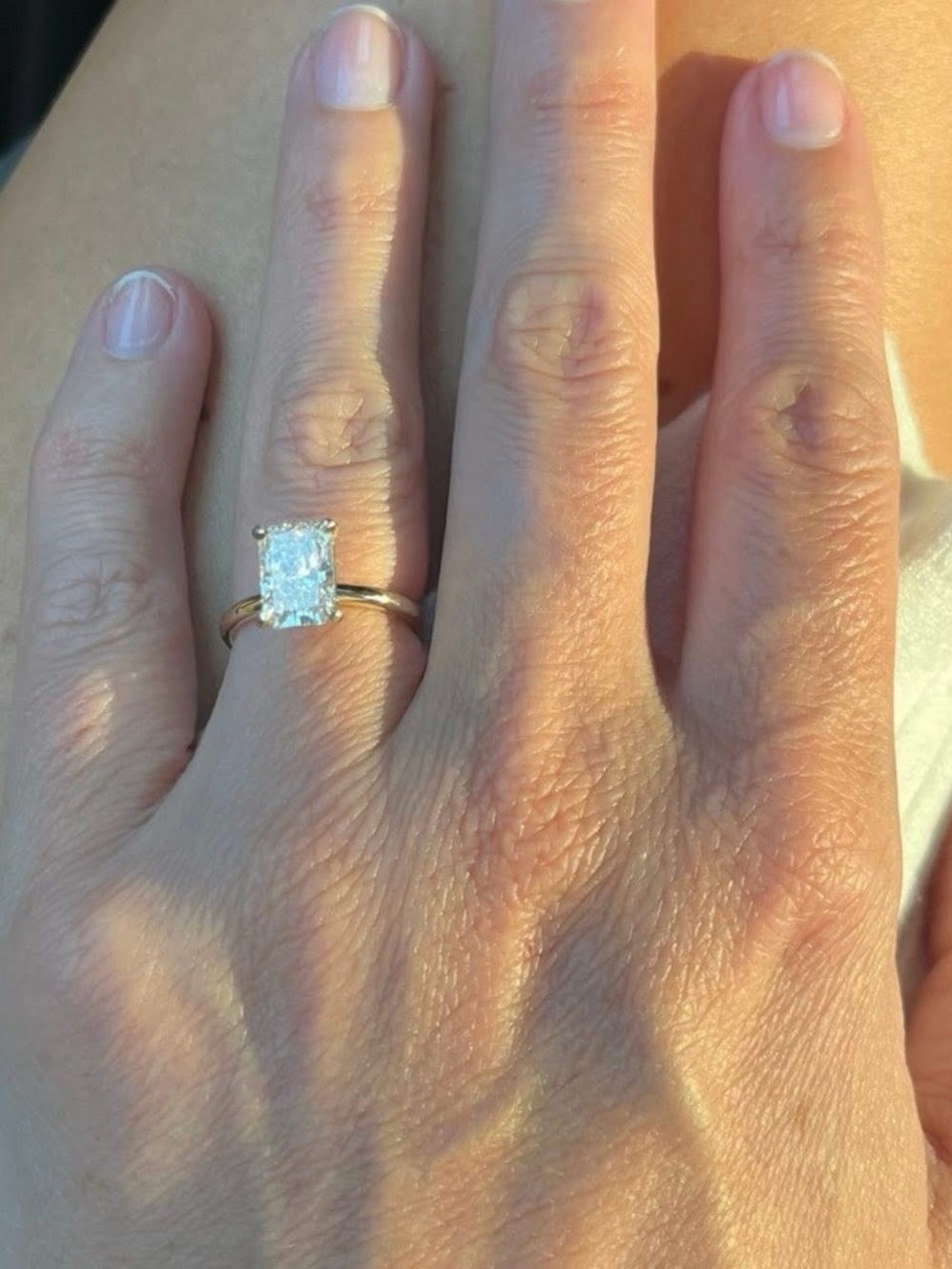 two carat radiant cut diamond E in color on 14k size 6 yellow gold band